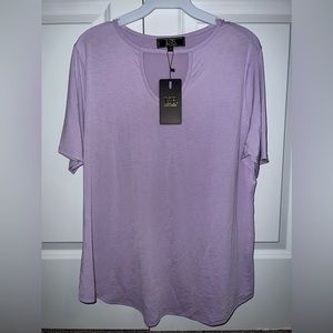 New in packaging,Women’s violet blouse. Sizes xl-3xl